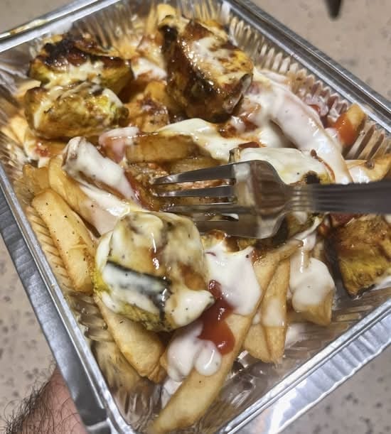 Chicken Kebab Over Fries.